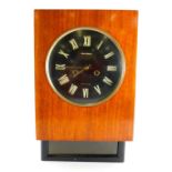A Jantaz Russian wall clock, in a teak and ebonised case, 42cm high.