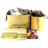 A Commodore Amiga personal computer, with various computer disks, some boxed computer games, joy