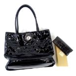 A Lulu Guinness patent leather black ladies handbag, and a Mulberry leather spectacles case.