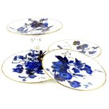 A Victorian porcelain part dessert service, decorated with fuchsia in deep blue, picked out in gilt,