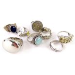 Eight silver and other dress rings, comprising a silver gent's signet ring, a silver plated dress
