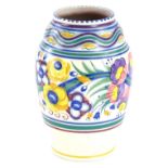 A Poole pottery bullet shaped vase, decorated in typical fashion with flowers, leaves etc., in