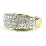 A 9ct gold half hoop dress ring, pave set with tiny diamonds in a white metal setting, on a yellow