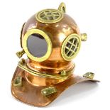 A brass and copper model of a divers helmet, unmarked, 19cm high.