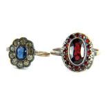Two dress rings, comprising a silver and red paste stone set dress ring, and a 9ct gold cluster