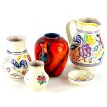 A collection of five items of Poole pottery, to include a later delphis style vase with black