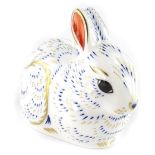 A Royal Crown Derby bunny paperweight ornament, gilt stopper, printed marks beneath, 8cm high.