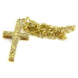 A 9ct gold cross pendant and chain, the small cross with scrolled design, on a fine link chain,