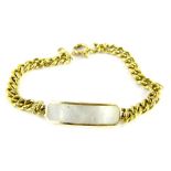 An 18ct gold identity bracelet, with single identity bar set with mother of pearl, on link chain,