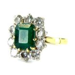 An 18ct gold emerald and diamond dress ring, with central octagon cut emerald, 8mm x 7mm x 4.2mm,