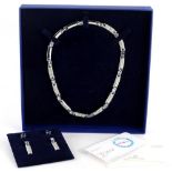 A Swarovski crystal jewellery set, comprising necklace, drop earrings and stud earrings, each set