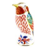 A Royal Crown Derby bird paperweight ornament, gilt stopper, printed marks beneath, 11cm high.