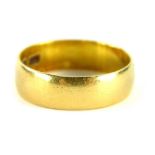 A 22ct gold thick wedding band, of plain design, ring size R, 5.1g all in.