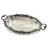 A silver plated two handled tray, the border cast with scrolls and leaves, the centre with an