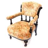 A late Victorian ebonised and parcel gilt open armchair, with a padded button back, arm rests and