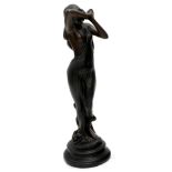 An Art Nouveau style resin bust of a lady in flowing robes, in naturalistic base and inverted