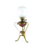 A late 19th/early 20thC copper and brass Arts and Crafts oil lamp, in the manner of W.A.S. Benson,