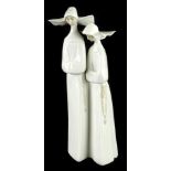 A Lladro Daisa figure group of two nuns, A611, printed and impressed marks beneath, 36cm high.