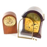 Two mahogany cased mantle clocks, the larger example with an arched brass dial and chapter ring