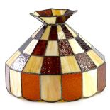 A Tiffany style shade, of shaped form, set with milk glass and amber style panels, 40cm high.