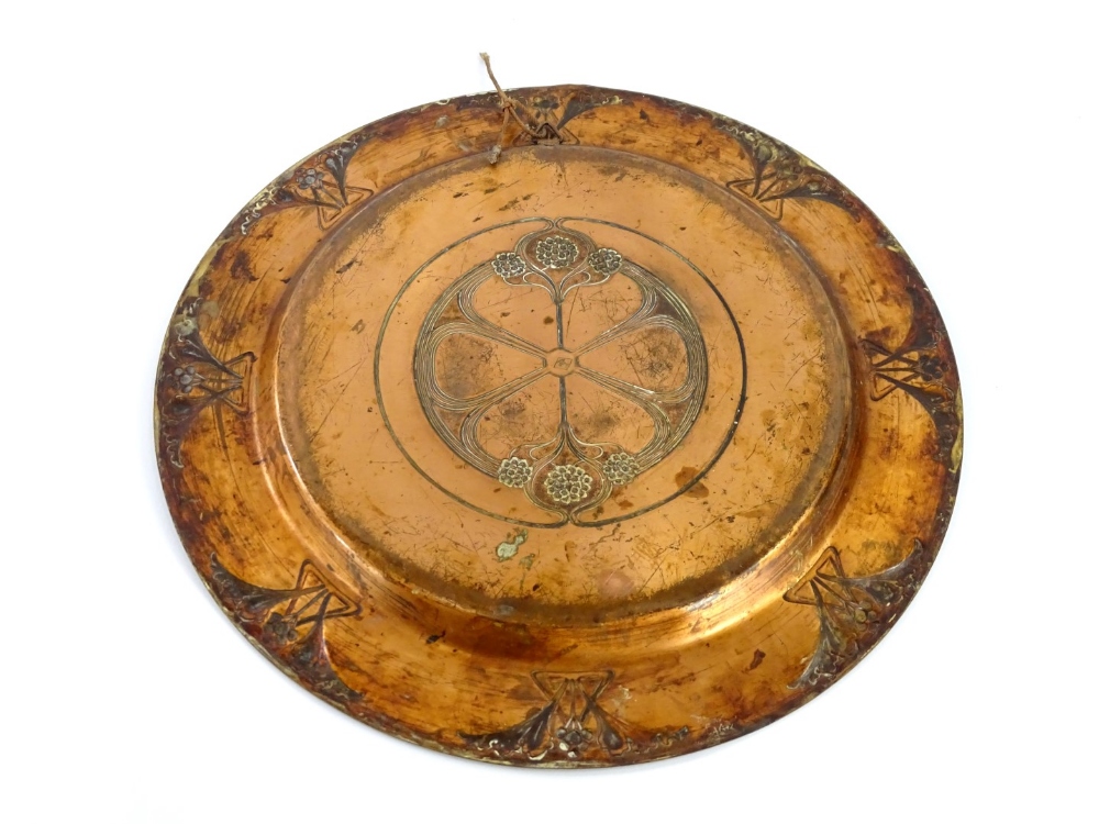 A late 19thC WMF Art Nouveau copper charger, decorated with flower heads, scrolls, etc., around a - Image 2 of 3