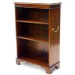 A mahogany open bookcase, the top with a moulded edge above two adjustable shelves flanked by