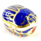 A Royal Crown Derby millennium bug paperweight ornament, gilt stopper, printed marks beneath, 6cm