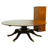 A high quality mahogany 'Jupe' style extending dining table in Regency manner