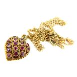 A 9ct gold garnet set heart pendant and chain, the heart pendant of pierced twist and openwork