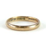 A 9ct gold wedding band, of plain polished form, ring size N½, 2.6g all in.