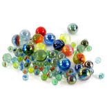 Various marbles, to include extra large size swirl example 4cm diameter, various others etc. (a
