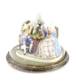 A 19thC continental porcelain bisque figure group, modelled with people in 18thC dress playing a