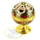 A Royal Crown Derby Imari porcelain Millennium globe barometer, the hinged lid with the motto, He