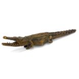 Tribal Art. A carved African model of a crocodile, 110cm long.
