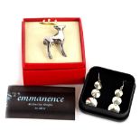 Two items of modern jewellery, comprising a pair of silver drop earrings and a reindeer brooch. (2)