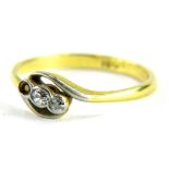 An 18ct gold platinum and diamond twist ring, set with three diamonds (one missing), in a platinum