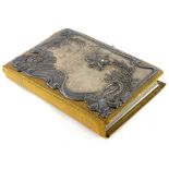 An unusual early 20thC simulated crocodile skin photograph album, the front board mounted with an