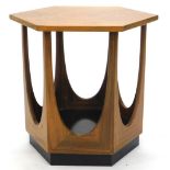 An unusual G-Plan teak occasional table, the octagonal top with radiating veneers, on shaped
