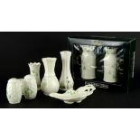 A collection of Belleek porcelain, to include a pair of mugs, each decorated with shamrocks and