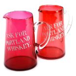 A very early 20thC cranberry and clear glass advertising jug, Ask for Portland Whisky, of circular