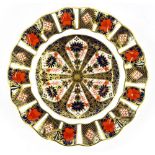 A Royal Crown Derby old Imari pattern plate, with a wavy edge, marks in red, 22cm diameter.