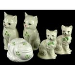 A pair of Belleek Quizzical cats, each decorated with shamrocks, a pair of Donegal Belleek larger