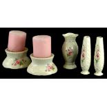 A collection of Donegal Belleek porcelain, each piece decorated with pink flowers, to include two