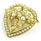 A heart shaped seed pearl pendant/brooch, in heart shaped design set with seed pearls, in a yellow