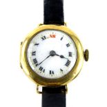 A 9ct gold cased wristwatch, the white enamel dial with Roman numerals and gold marked to border,