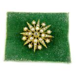 A 9ct gold diamond and pearl star brooch, with central old cut diamond, 3.2mm x 2mm, approx 0.13cts,