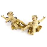 A pair of continental polychrome and gesso putti, each with silvered wings, 26cm high.