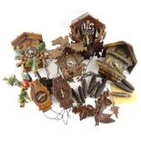 A collection of four Black Forest type cuckoo clock, various models to include examples carved