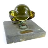 A late 19th/early 20thC Campbell Stokes sunshine recorder, with glass ball and bronzed metal