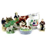 A collection of 19thC Staffordshire figures, to include a seated gentleman with a tankard, figure of